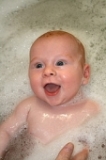 This image has an empty alt attribute; its file name is babybath.jpg